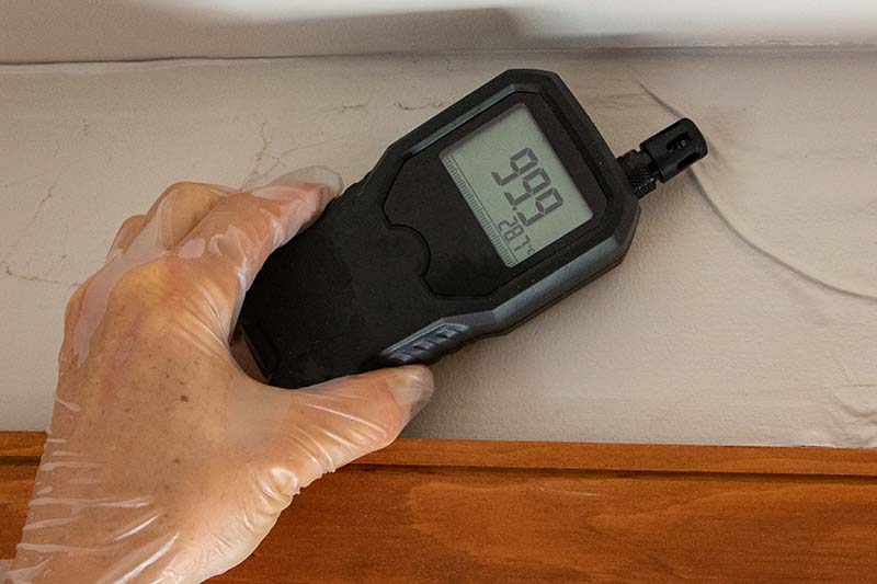 Moisture meter being used by our certified home inspectors